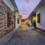 Quaint and colorful streets of a traditional Colombian village, filled with vibrant culture and history